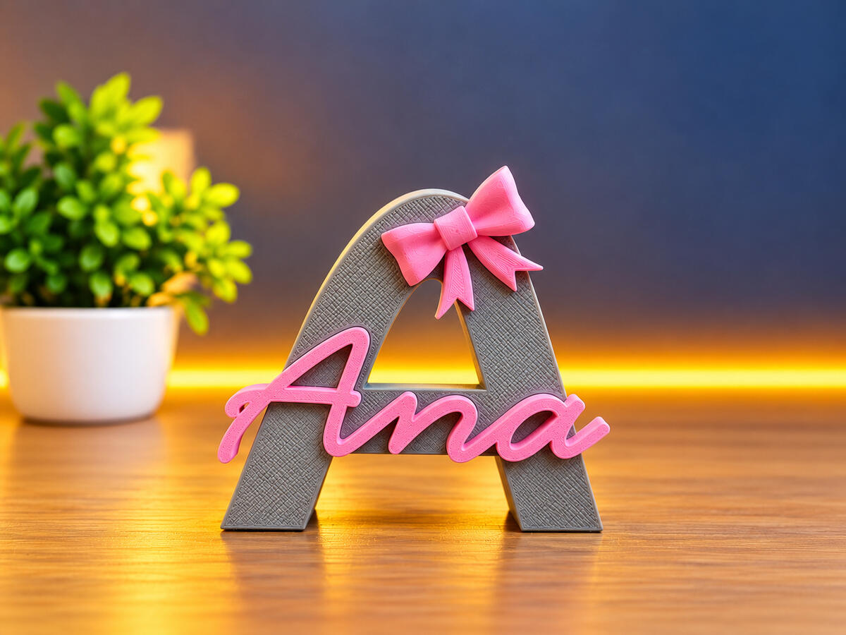 Custom 3D printed letter A with the name Ana and a pink bow, created by 3DZ6.