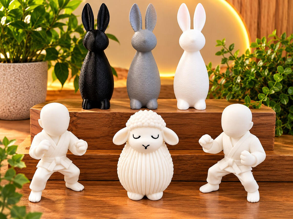 Custom 3D printed decorative figurines including rabbits, sheep and martial arts figures